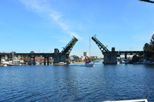 University Bridge, Seattle, Washington, opened for a sailboat to pass, seen from the west.