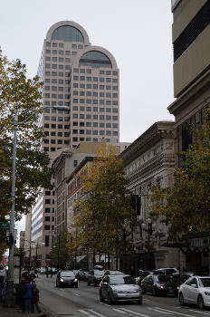 Seattle, Washington, USA, looking west on Pike Street from Sixth Avenue. The tall building at center in background is Century Square.