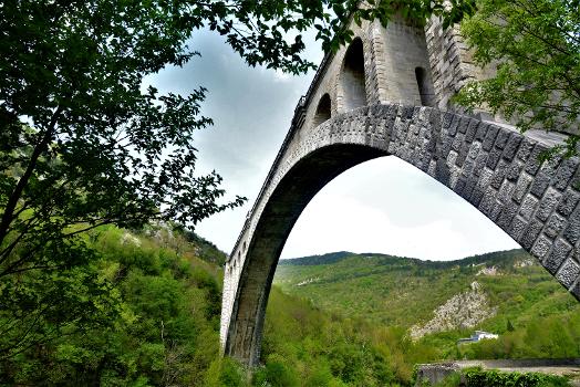 Solkan Bridge:The Solkan Bridge (Slovene: Solkanski most, Italian: Ponte di Salcano) is a 219.7-metre (721 ft) arch bridge over the Soča River near Nova Gorica in western Slovenia (by railway terminology it is a viaduct). With an arch span of 85 metres (279 ft), it is the longest stone bridge among train bridges built of stone blocks. It holds the record as later construction technology used reinforced concrete to build bridges. It was originally built in the time of the Secession, between 1900 and 1905, and officially opened in 1906