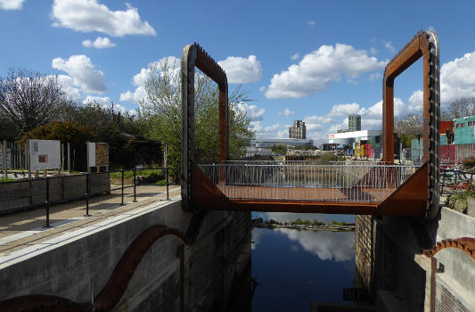 The Cody Dock Rolling Bridge designed by Thomas Randall-Page : The square cog design, rolling on catenary curve tracks - together with a balanced centre of gravity - enables the bridge to be rolled between higher and lower positions with minimum effort.