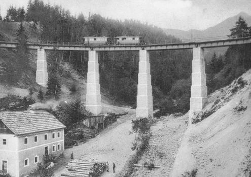 A train of the Stubaitalbahn in Tyrol, Austria, is passing the Mutterer bridge
