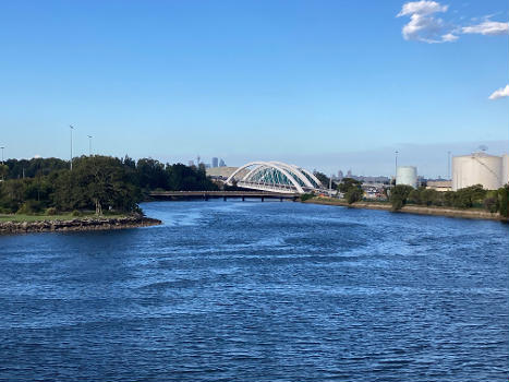 The Twin Arch Bridges as part of the Sydney Gateway project, viewed from Marsh Street. The eastbound bridge has been completed and open to traffic. The westbound bridge at the back is still under construction.