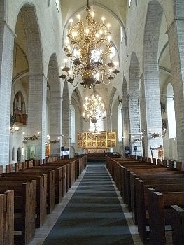 St. Nicholas' Church, Tallinn:Central nave of the Interior of St. Nicholas' Church, now the Niguliste Museum, with a view on the central altarpiece and the Renaissance chandeliers; Tallinn, Estonia