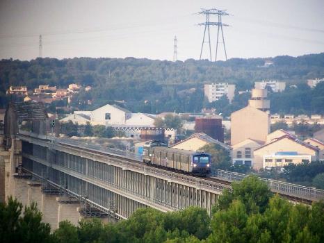 Caronte Bridge:French regional train coming from Miramas and moving to Marseille crosses the viaduc of Caronte bridge just before entering the station of Martigues in Bouches-du-Rhône.