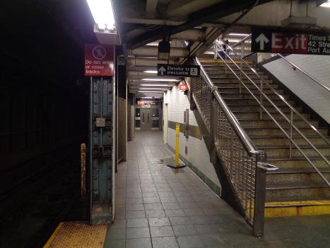 Looking at the north end of the Downtown BMT Broadway platform at the Times Square–42nd Street subway station in Times Square, Manhattan.