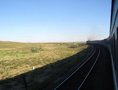 A view from the train while traveling along the path of the Trans-Aral Railway. Much of the railway cuts across the vast, rolling Kazakh steppe. (Taken in June 2005)