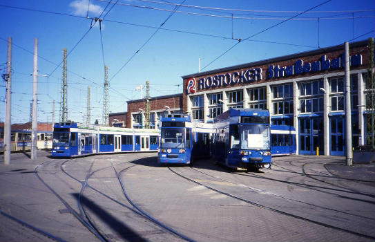 New low floor 6NGT Duewag/Bautzen/ABB/Siemens trams outside the depot in Rostock with a solitary Gotha unit at the rear : Right to left, 665 655 653. 6NGTWDE trams were numbered from between 1994 and 1996.