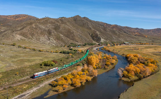 Ulaanbaatar Tömör Zam 2TE116UM with northbound freight train. Pictured between Tynh (Түнх) and Narst (Нарст), Mongolia.