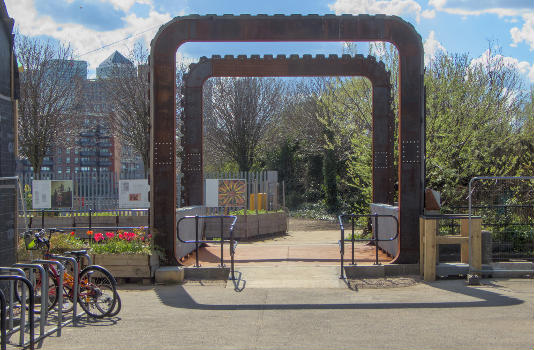 The Cody Dock Rolling Bridge designed by Thomas Randall-Page : The square cog design, rolling on catenary curve tracks - together with a balanced centre of gravity - enables the bridge to be rolled between higher and lower positions with minimum effort.