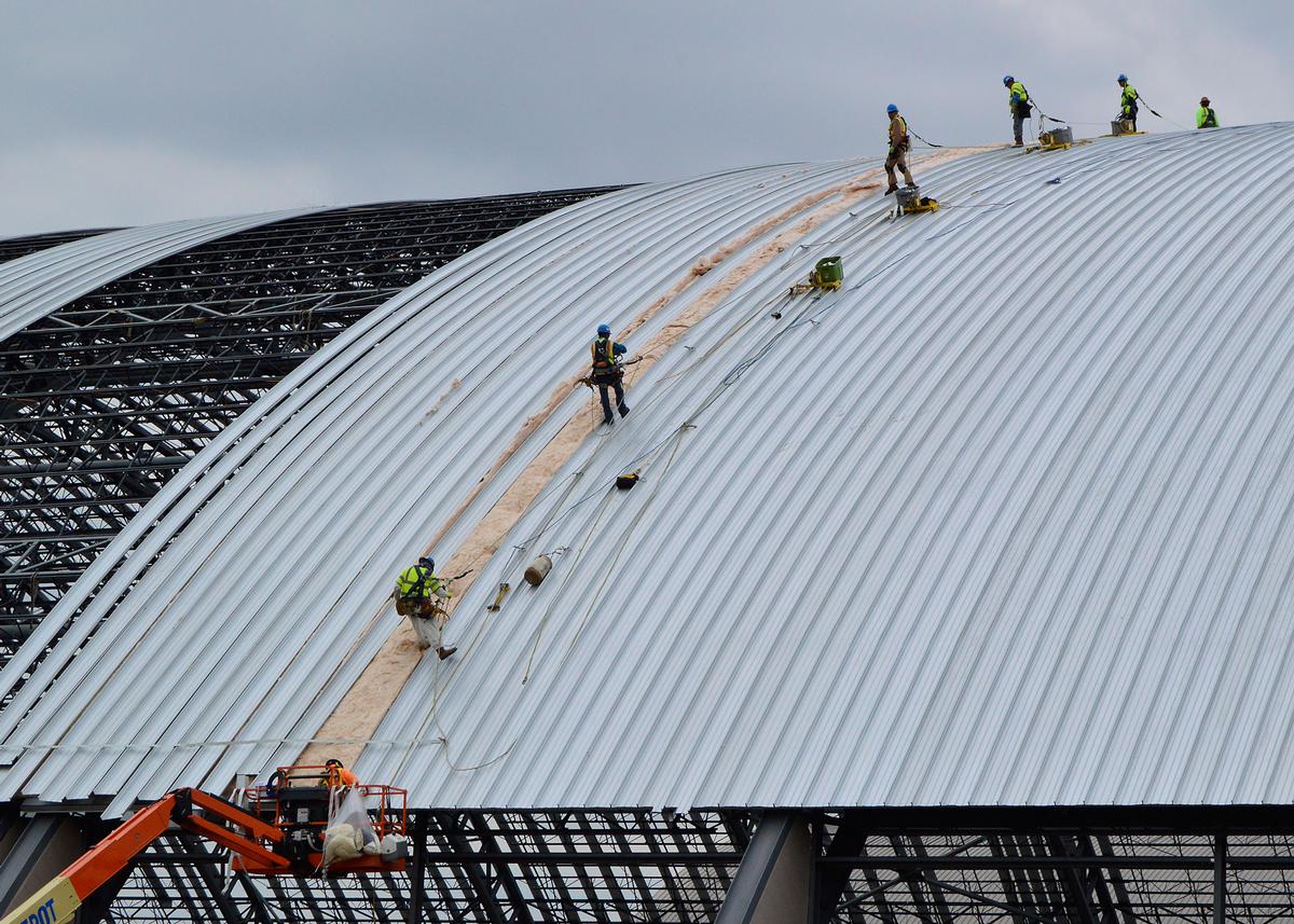 Media File No. 241315 Dayton, Ohio – Crews working on the roof installation for the museum's fourth building on June 12, 2015. The 224,000 square foot building, which is scheduled to open to the public in 2016, is being privately financed by the Air Force Museum Foundation, a non-profit organization chartered to assist in the development and expansion of the museum's facilities