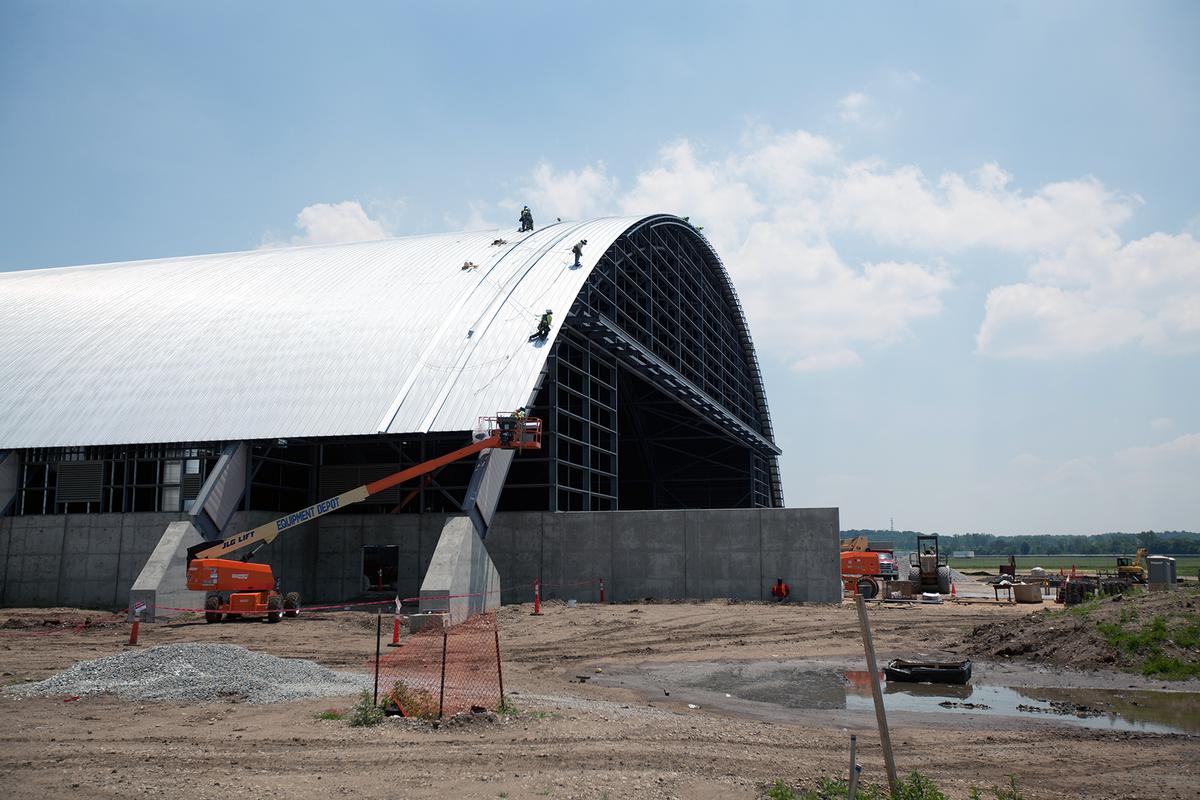 Media File No. 241314 Dayton, Ohio – Crews working on the roof installation for the museum's fourth building on June 12, 2015. The 224,000 square foot building, which is scheduled to open to the public in 2016, is being privately financed by the Air Force Museum Foundation, a non-profit organization chartered to assist in the development and expansion of the museum's facilities