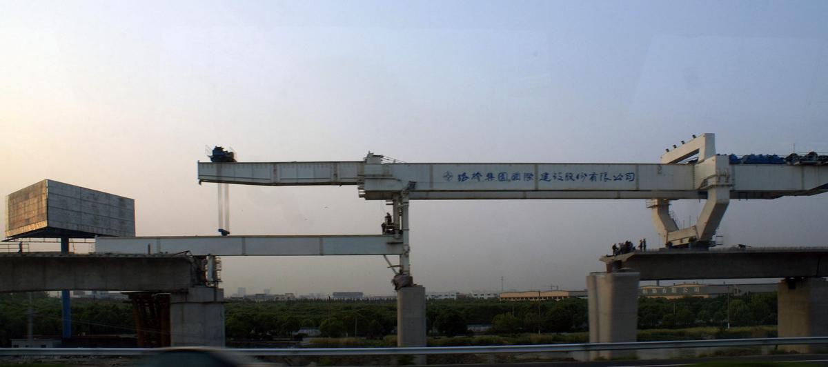 Structures of the Beijing-Shanghai high-speed rail line under construction along the highway between Nanjing and Shanghai 