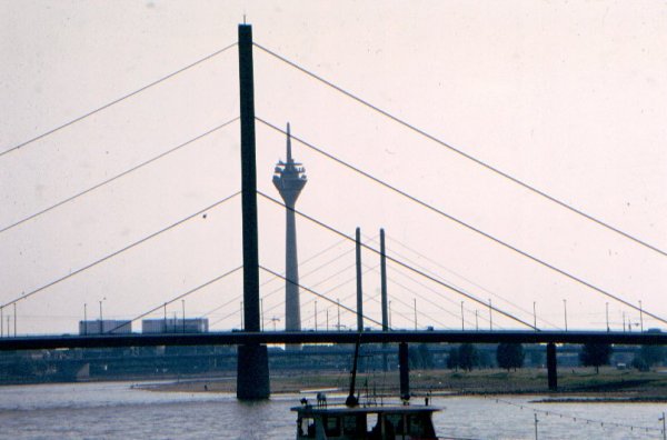 Pylon of the Oberkassel Bridge with the Knee Bridge and the Rhine Tower in the background (Düsseldorf, Germany)