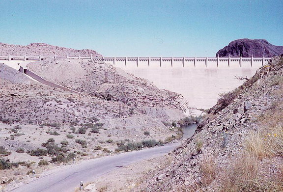 Elephant Butte dam from downstream Notice «Elephant Butte» to right, behind dam; left side of head visible