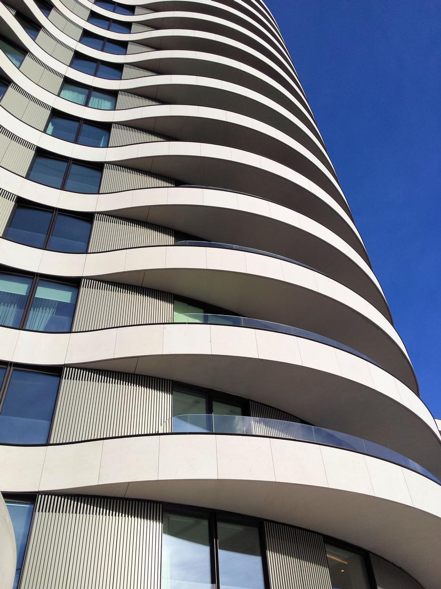 The balconies help to create a continuous organic shape. 
