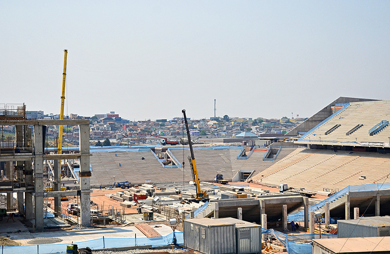 The Corinthians Arena under construction with São Paulo in the background 
