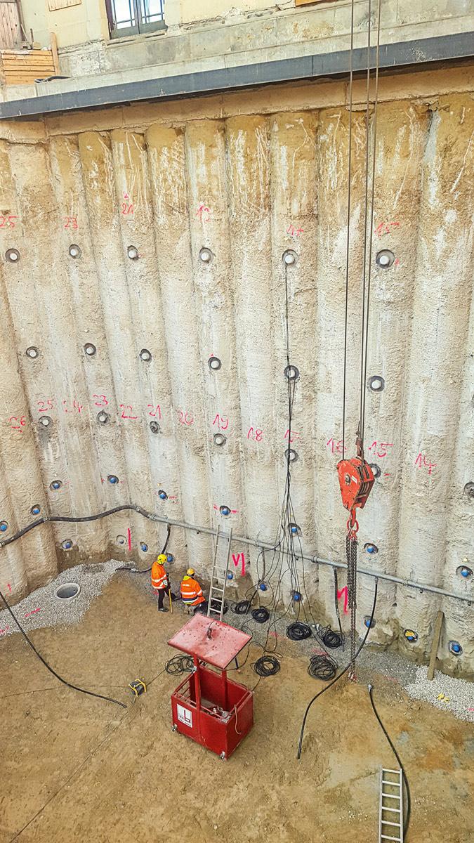 To stabilize pile wall and girder support system, 170 temporary strand anchors were installed. To stabilize pile wall and girder support system, 170 temporary strand anchors were installed.