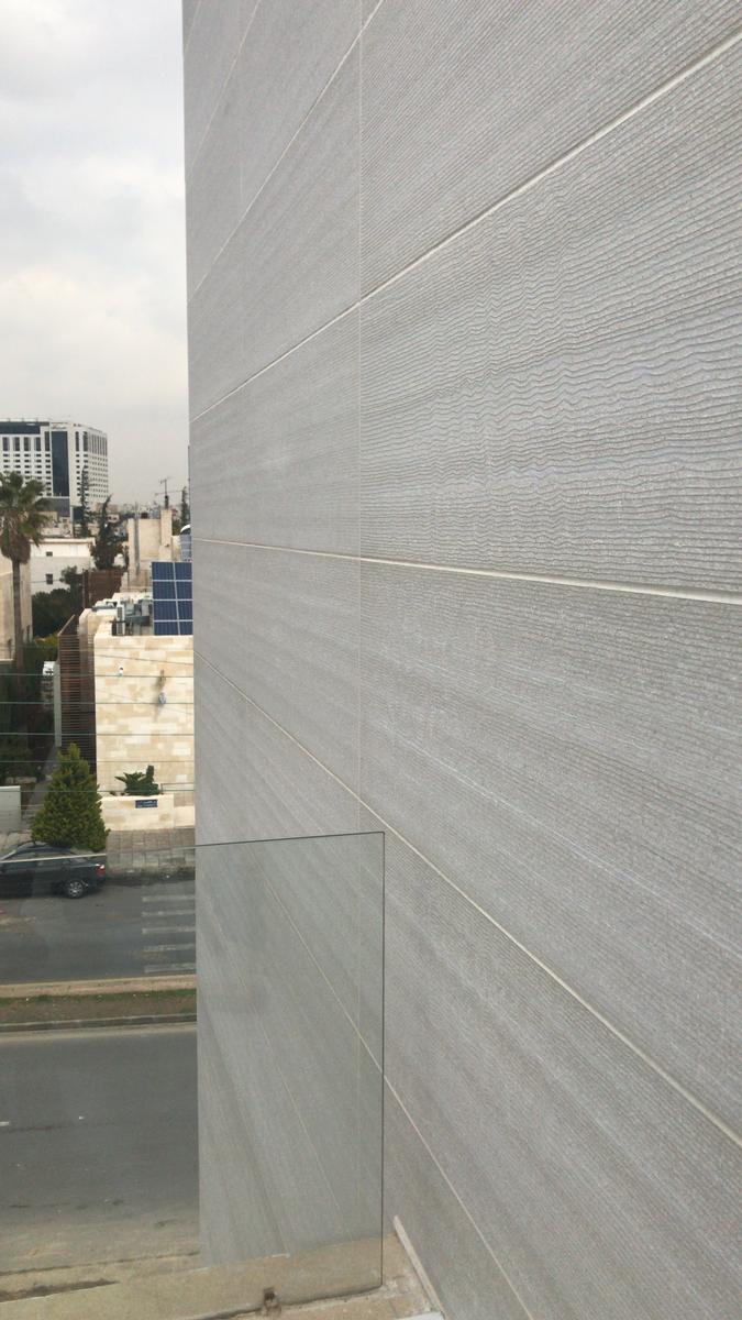 Not backlit, light concrete looks like natural stone. The concrete is matched in color to the façade of the bank. Not backlit, light concrete looks like natural stone. The concrete is matched in color to the façade of the bank.