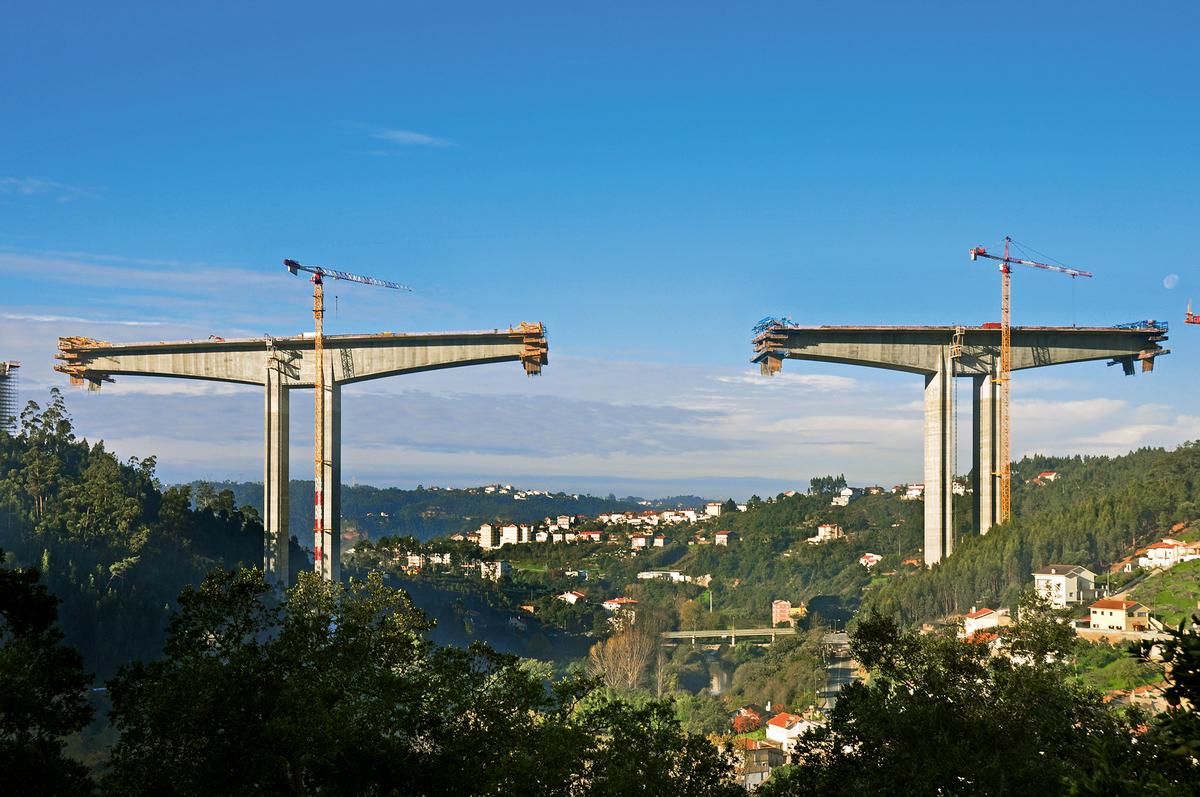 A picturesque landscape surrounds the bridge. 