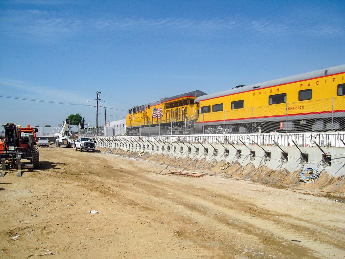 Long wait times at the railroad crossings and the ensuing environmental impact will be eliminated by the San Gabriel Trench. Long wait times at the railroad crossings and the ensuing environmental impact will be eliminated by the San Gabriel Trench.