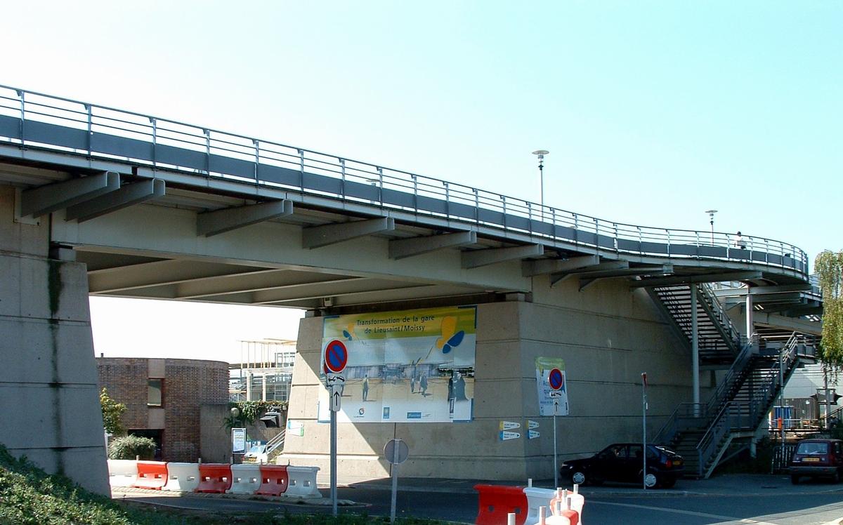 Viaduct across the railroad tracks near the train station at Lieusaint, France 