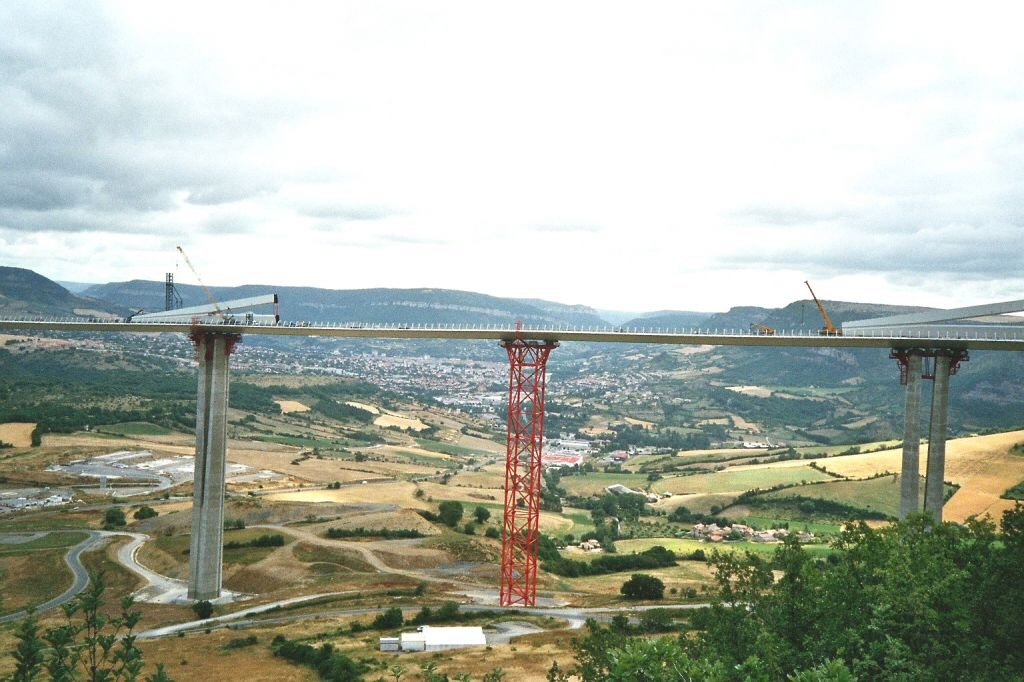 Millau Viaduct Pylons P5 and P6 are waiting to be lifted; the city of Millau can be seen in the background