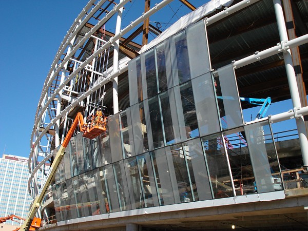 Exterior progress photo showing installation of modulated and from Overgaard Ltd. pre-assembled glass elements 