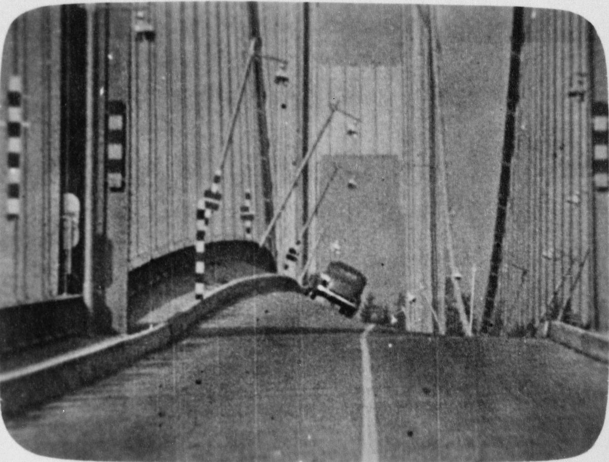 Media File No. 198851 Vertical and torsional motion from east tower Showing angular distortion approaching 45 Degrees with lamp posts appearing to be at Right angles, 7 November 1940, from 16mm film Shot by Professor F. B. Farquharson, University of Washington. ("Laboratory studies on the Tacoma Narrows Bridge, at University of Washington" [Seattle: University of Washington, Department of Civil Engineering, 1941]) (HAER WA-99-35)