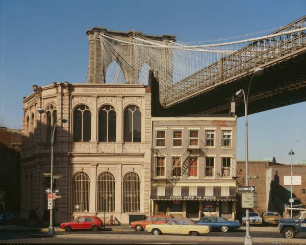 Brooklyn Bridge View of Brooklyn tower emerging behind nineteenth century commercial buildings on the corner of front street and Camden plaza 
(HAER, NY,31-NEYO,90-80)