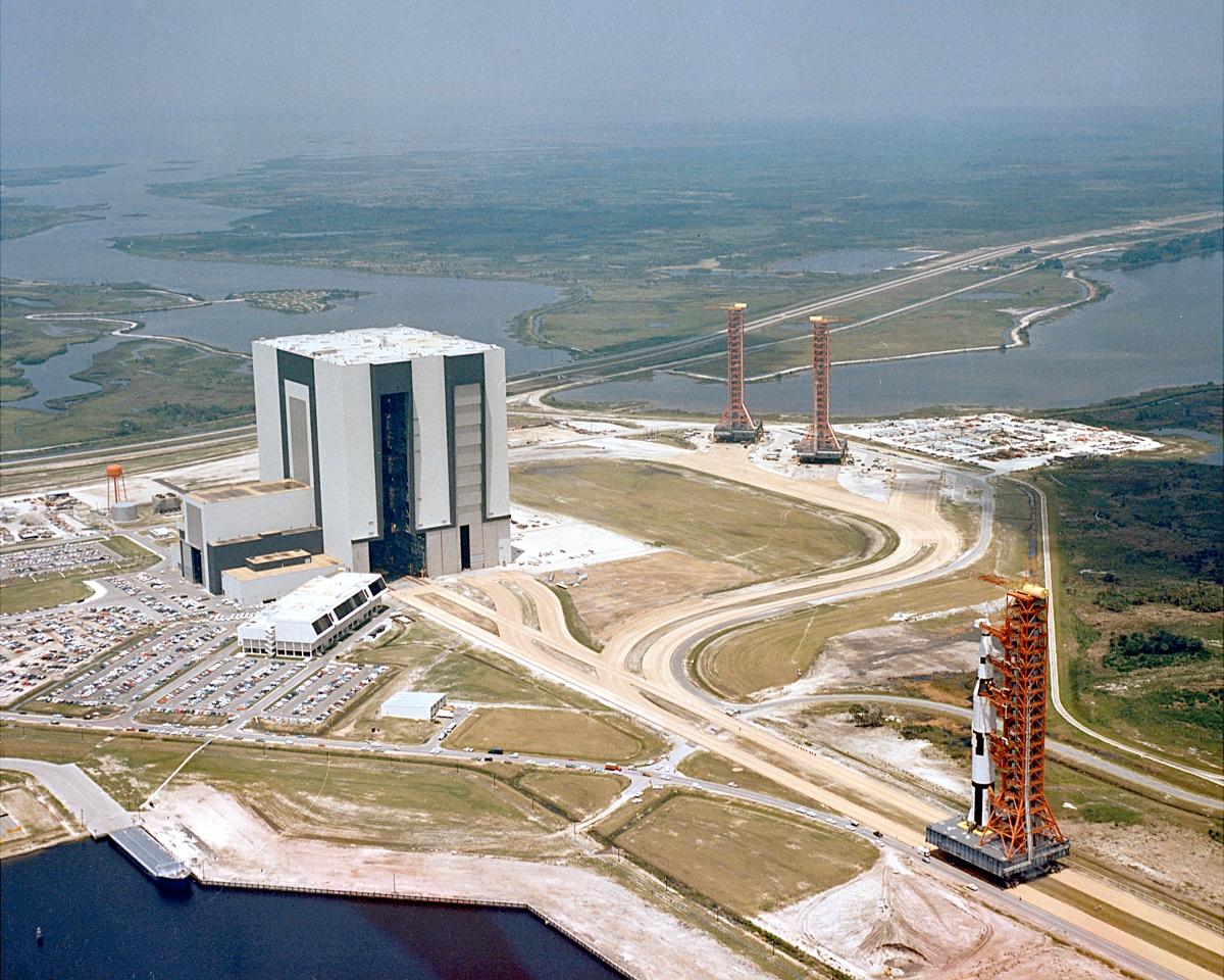 Vehicle Assembly Building (VAB) An aerial view of the Apollo Saturn V Facilities Test vehicle rolling out of the Vehicle Assembly Building (VAB) and heading to Launch Complex 39A. This test vehicle, designated the Apollo Saturn 500F, will never make the journey to the moon. However, it is being used to verify launch facilities, train launch crews, and develop test and checkout procedures.
