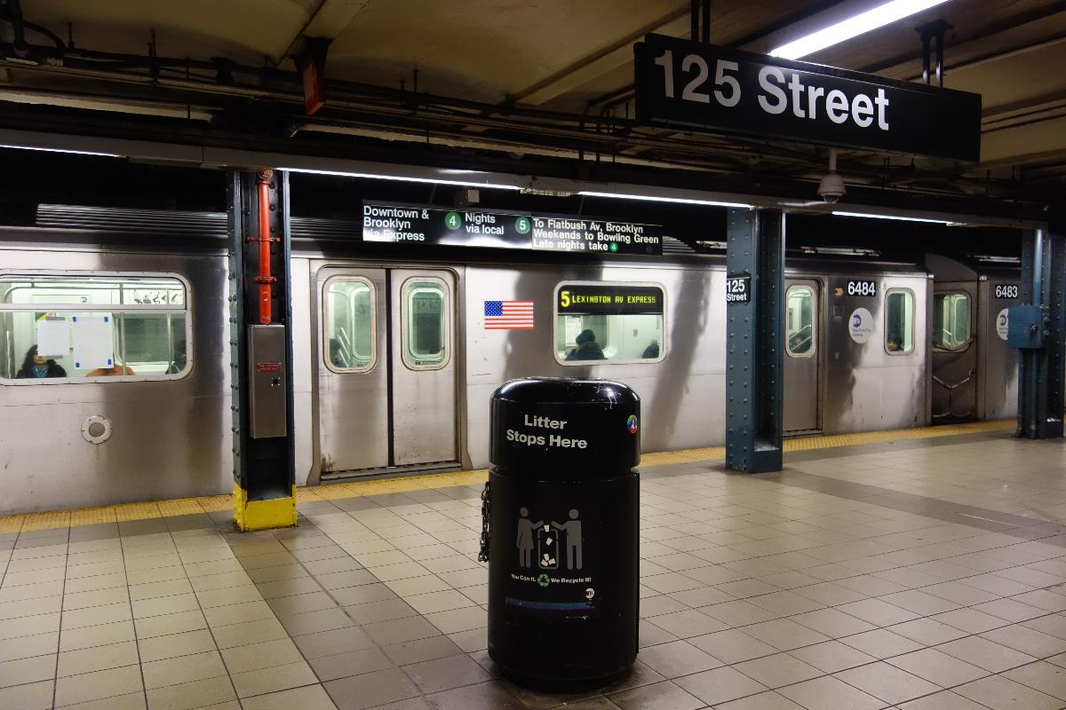 A Brooklyn-bound 5 train at the 125th Street IRT Lexington Avenue station in East Harlem, Manhattan. 