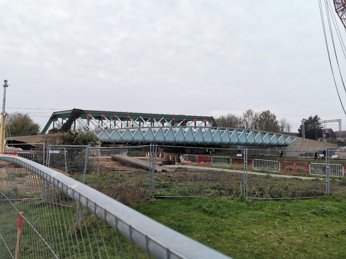 Brand-new Chesterton Abbey bridge in Cambridge, UK for cycling and pedestrians Existing railway girder bridge in background. Photographed on same day after being craned into position.