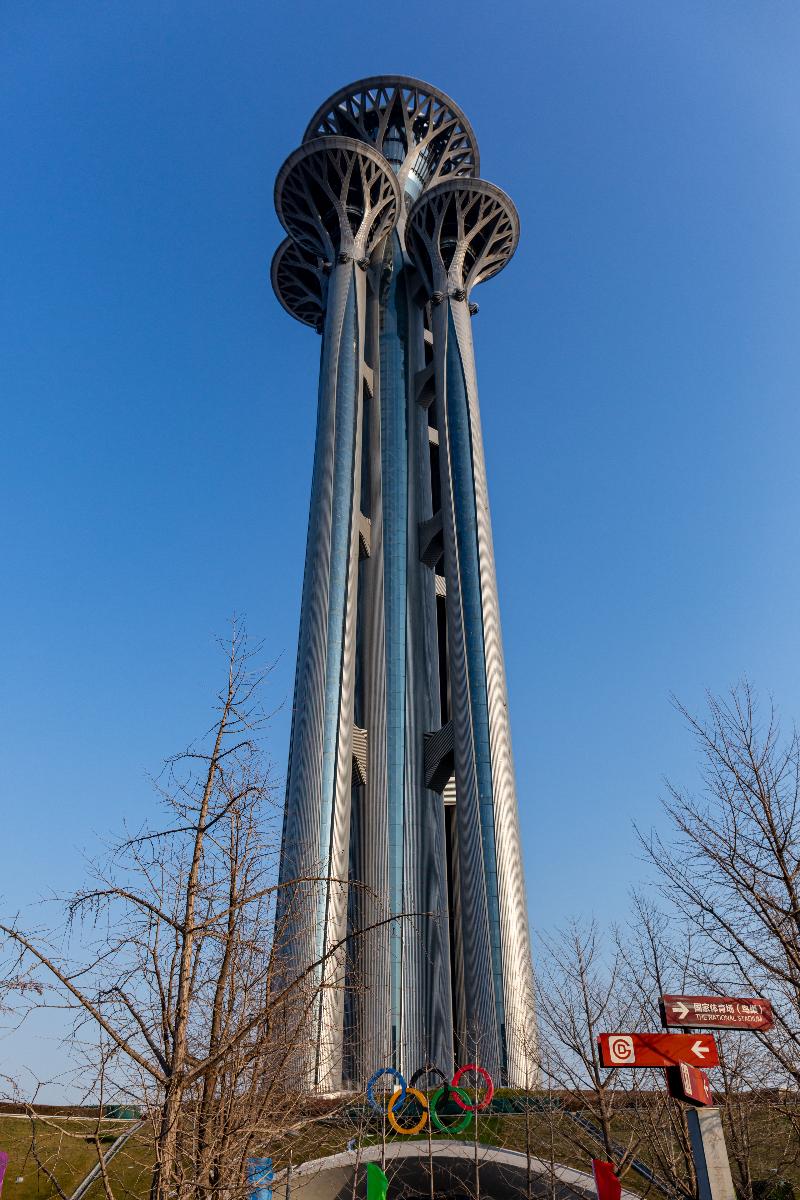 Ground-level view of the Olympic Park Observation Tower in Beijing. 