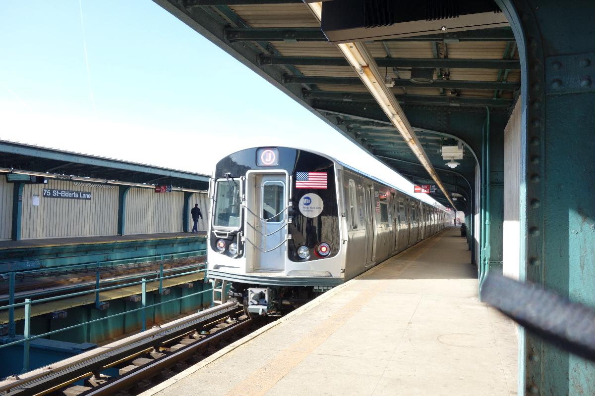 An R179 in Manhattan-bound J service leaving the 75th Street–Elderts Lane station in Woodhaven, Queens/Cypress Hills, Brooklyn 