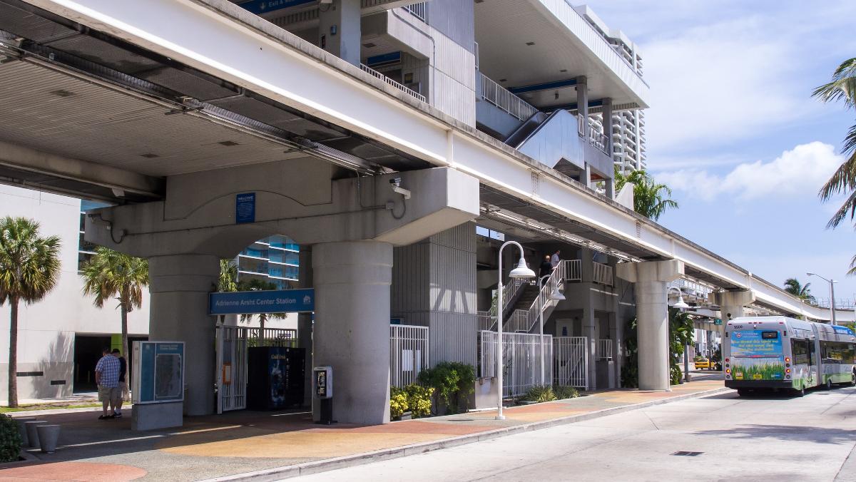 Adrienne Arsht Metromover station and a departing Metrobus city bus 