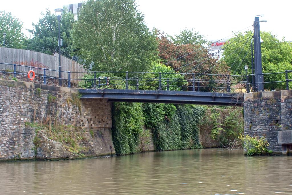 River Frome Footbridge Entrance to the Castle Moat (of the long demolished Bristol Castle which stood to the left) viewed from the "Floating Harbour", the natural course of the River Avon, now diverted into an artificial channel to the south. Footbridge over. This was the site of the "Water Gate", guarded by five towers ("Bristol Past and Present")