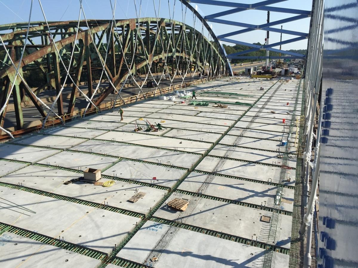 John Greenleaf Whittier Bridge Workers continue to install pre-fabricated concrete deck panels on the new Whittier Bridge northbound span.