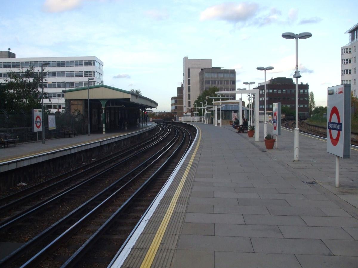 East Putney tube station District line platforms looking north, with the main line branch from Wandsworth town visible on the right No scheduled main line passenger services call at the station, but a service to Wimbledon uses the line south of here late at night.