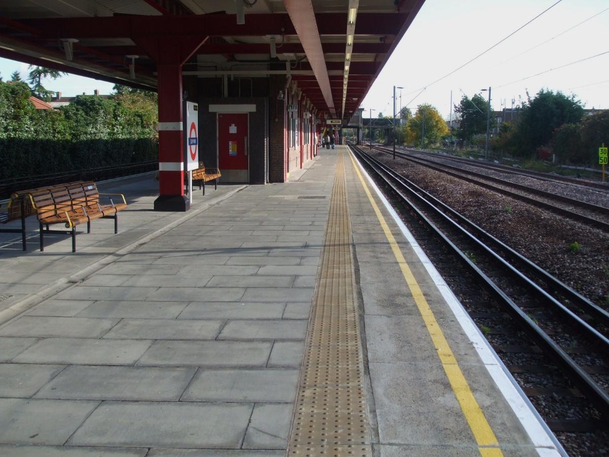 Elm Park tube station westbound platform looking east. London, Tilbury &amp; Southend line (operated by c2c) in background No platforms here for the latter.