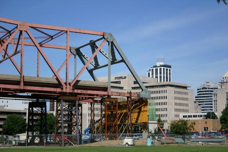 Peoria end of the Murray Baker Bridge during reconstruction In background at end of bridge, across top from center to right: Caterpillar Inc. World headquarters; Twin Towers; Becker Building; Commerce Bank (old First National Bank of Peoria); Caterpillar building (old Security Savings).