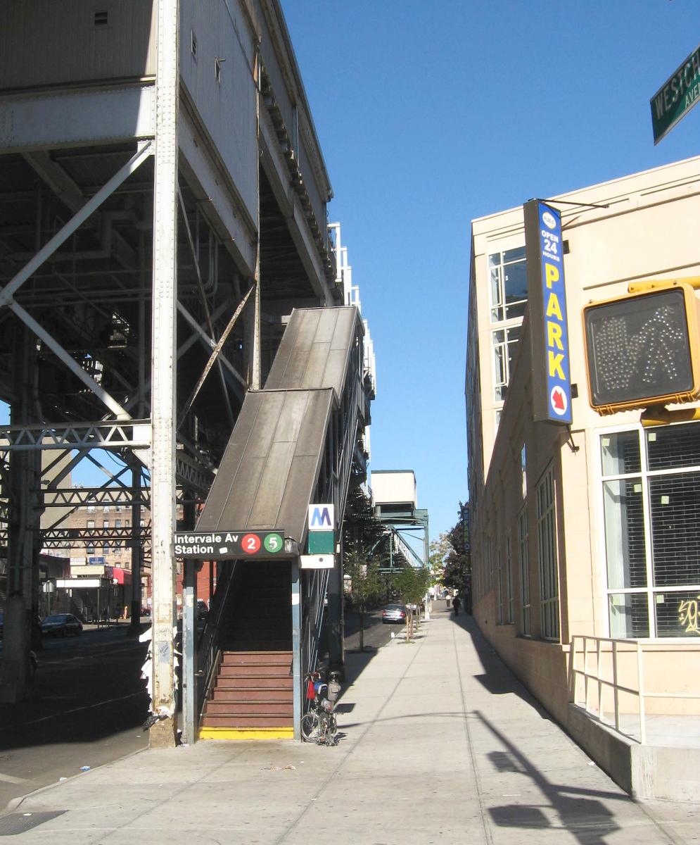 Looking northeast at southern street stair of Intervale Avenue (IRT White Plains Road Line) on a sunny early afternoon 
