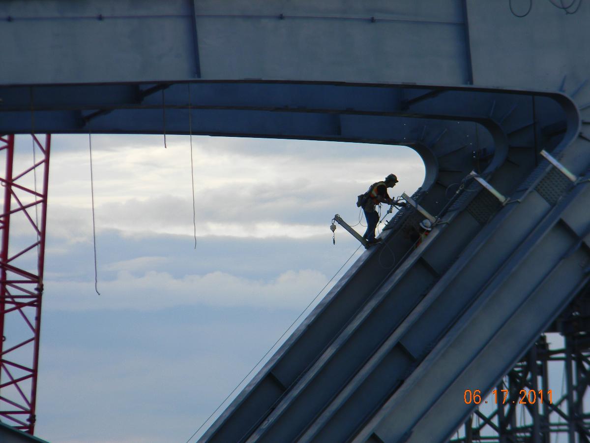 An iron worker on the bridge connecting Vermont and New York 