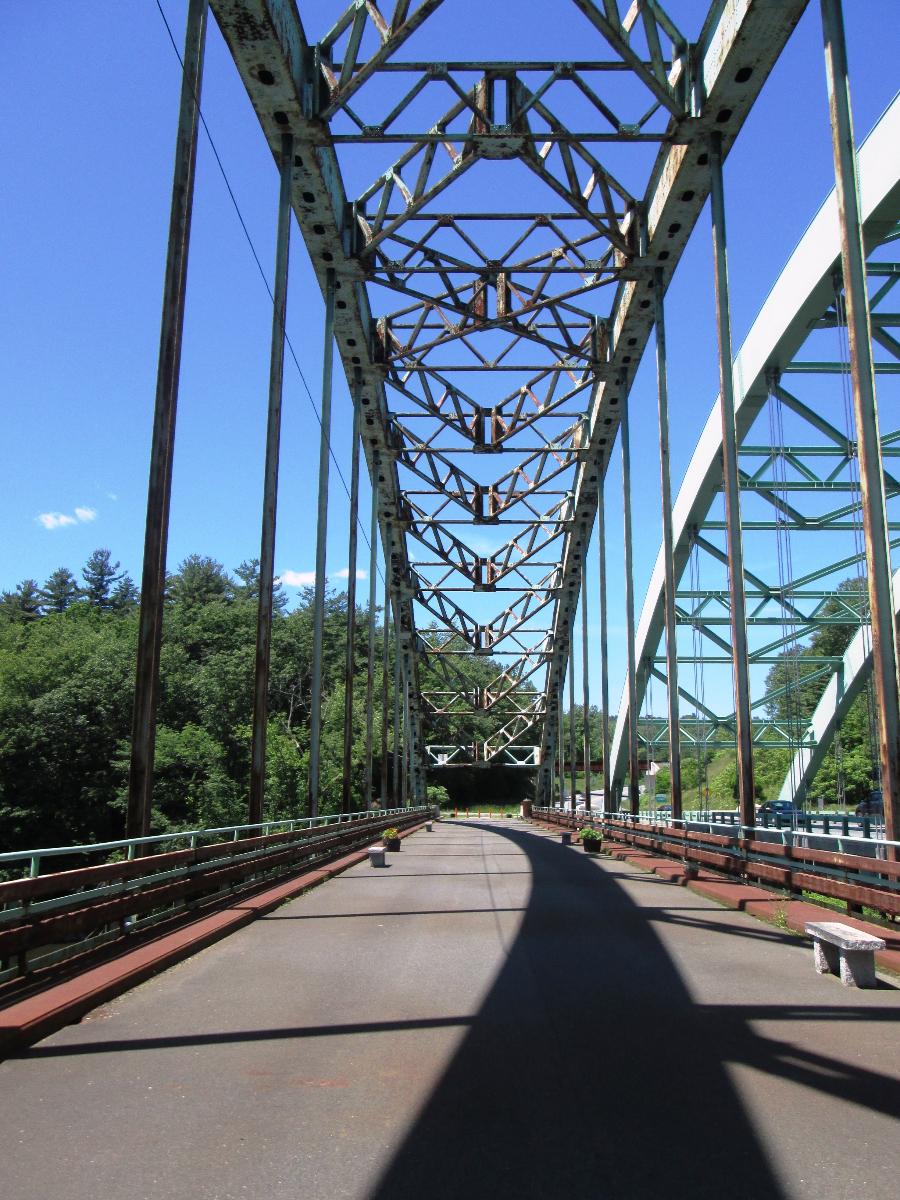 Looking west from the deck of the Justice Harlan Fiske Stone Bridge for pedestrians and bicycles To the right can be seen part of the United States Navy Seabees Bridge for cars and trucks, which replaced it.