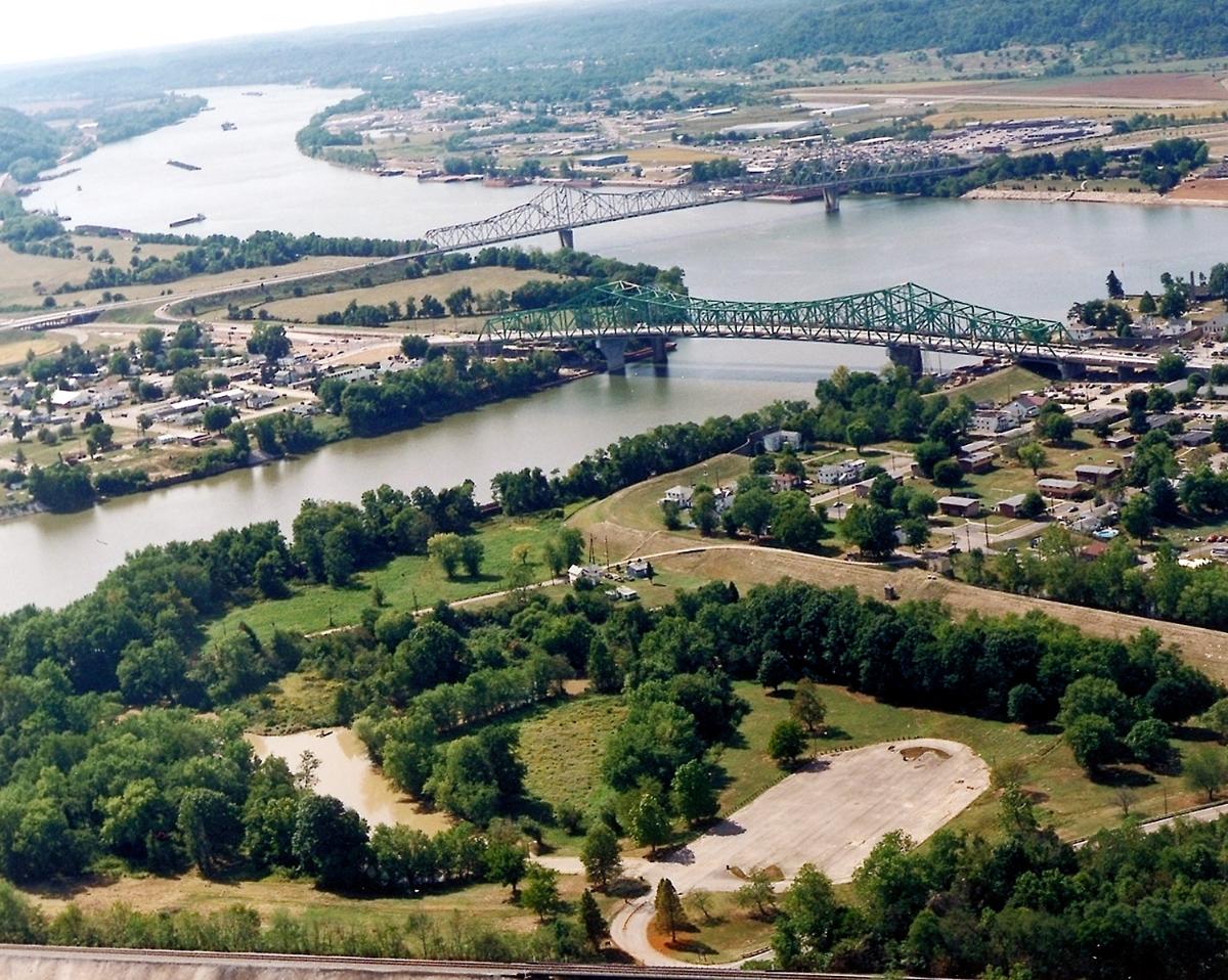 The confluence of the Kanawha and Ohio Rivers The Kanawha River flows in from the left of the picture and joins the Ohio, meandering off in the distance. The town of Point Pleasant, West Virginia is in the foreground on the right. Henderson, West Virginia is on the left. The Ohio River forms the boundary between West Virginia and Ohio. The town of Gallipolis, Ohio lies in the far distance across the Ohio River. The view is to the west-southwest down the river.