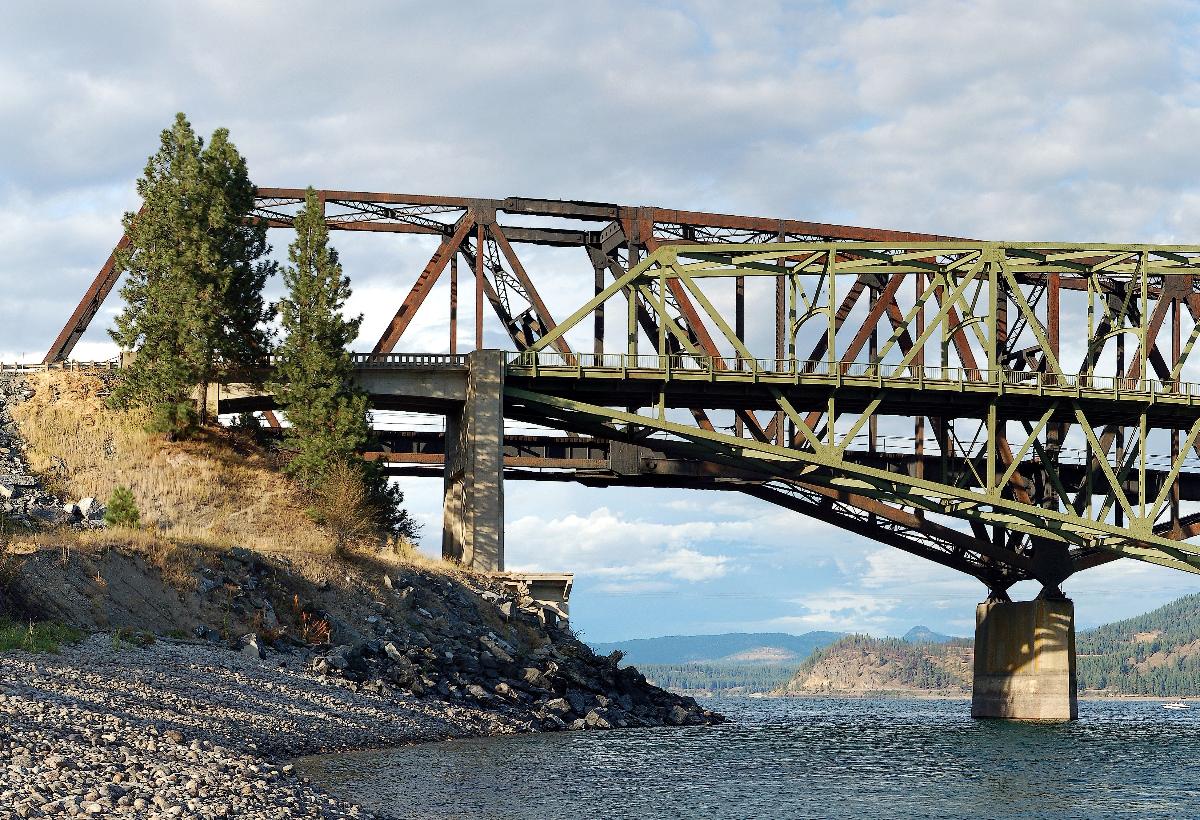 Twin bridges spanning the Columbia River at Kettle Falls, Washington Behind the highway bridge is the suspended span on the west side of the rail bridge