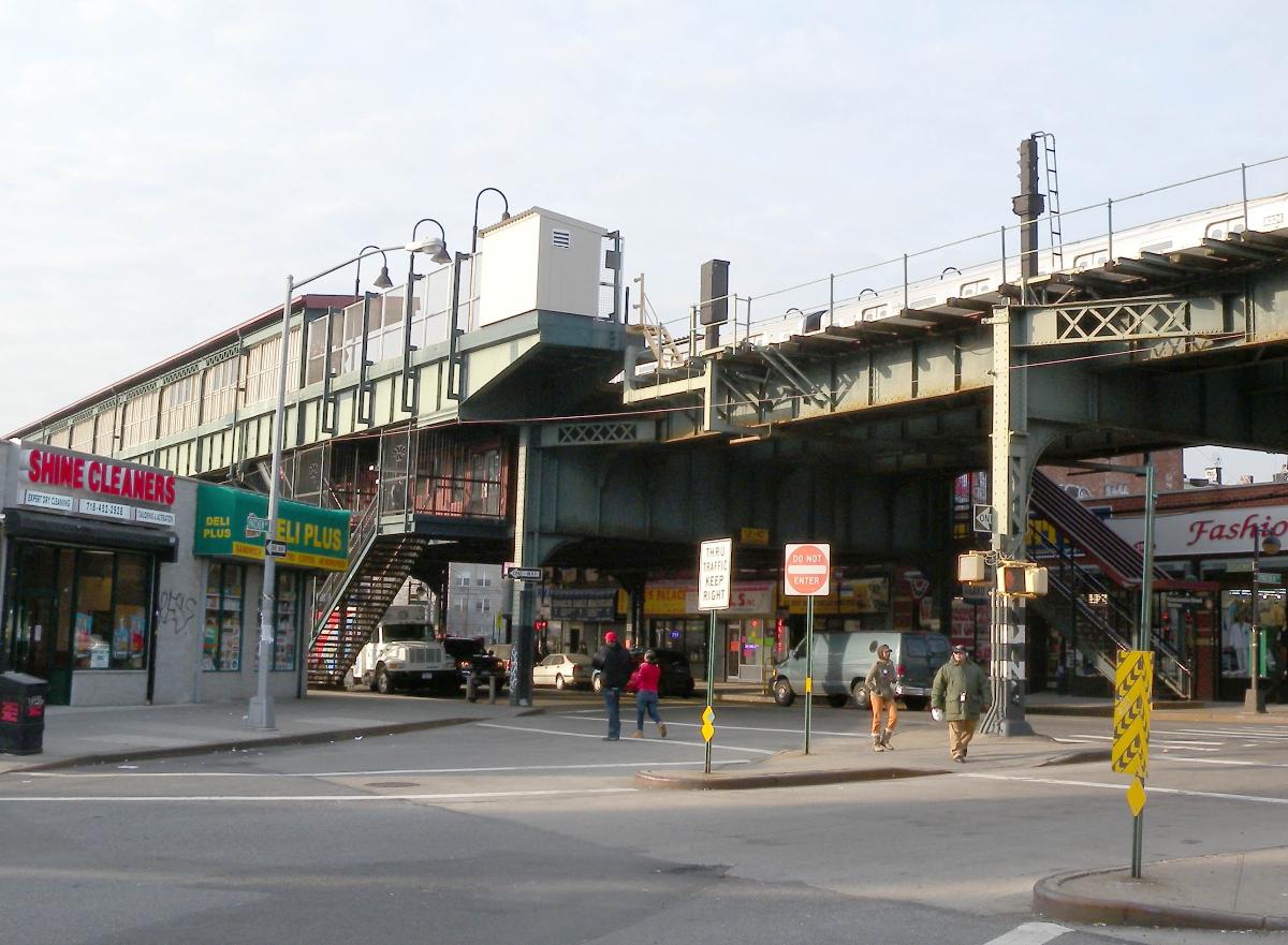 Looking northwest across Lafayette Avenue at Kosciuszko Street station of J train on a sunny afternoon. 