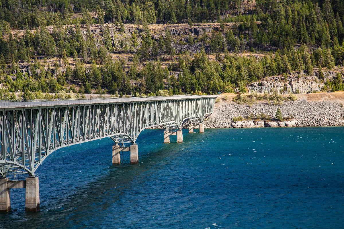 The Koocanusa Reservoir Bridge, a deck truss bridge built in 1971, connects Kootenai National Forest to Montana 37 near Rexford, Montana 