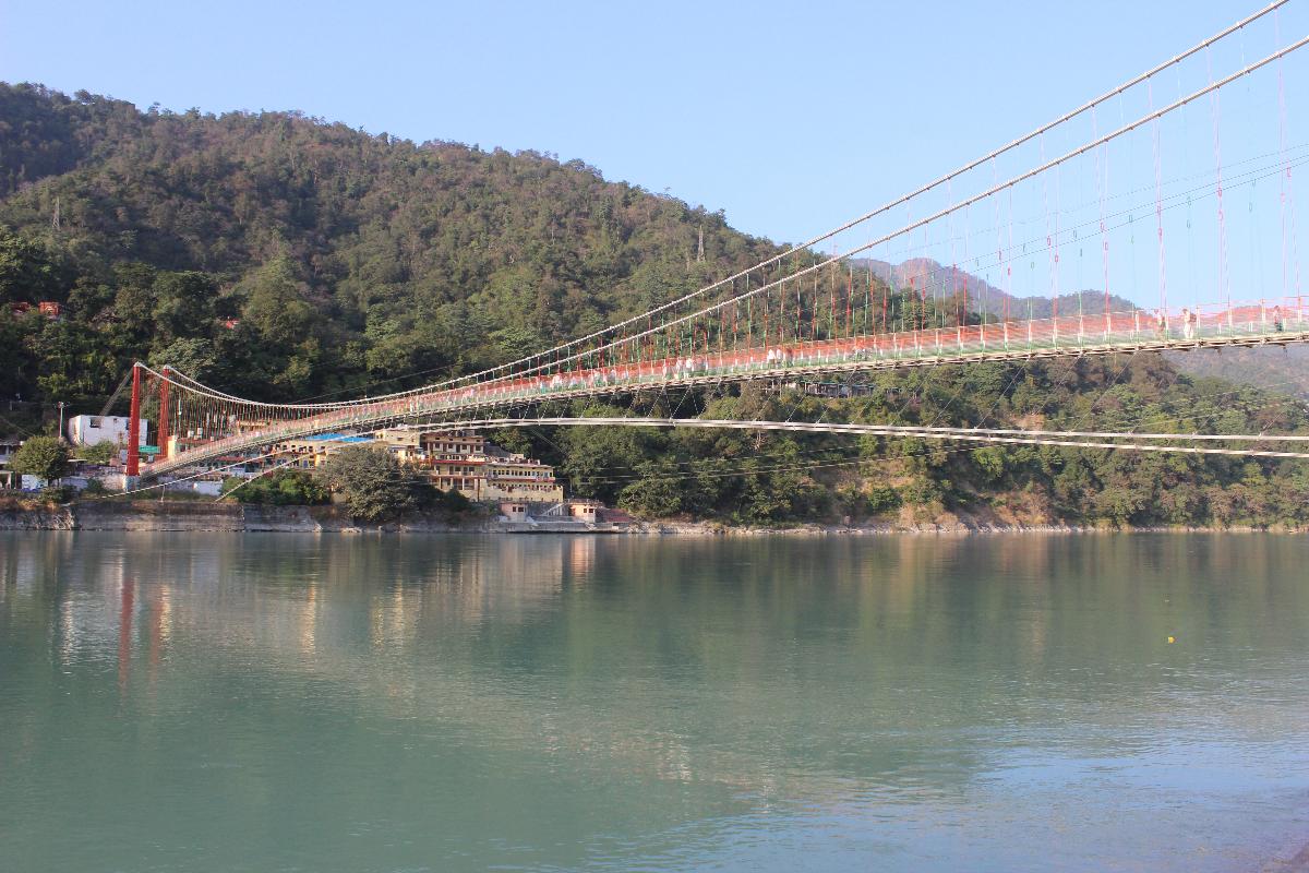 Lakshman Jhula is a suspension bridge across the river Ganges It is located 5 kilometres (3 mi) north-east of the city of Rishikesh in the Indian state of Uttarakhand.
