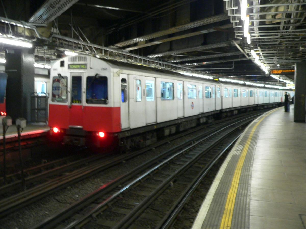 A London Underground District Line D stock EMU at platform 2 of Tower Hill tube station 