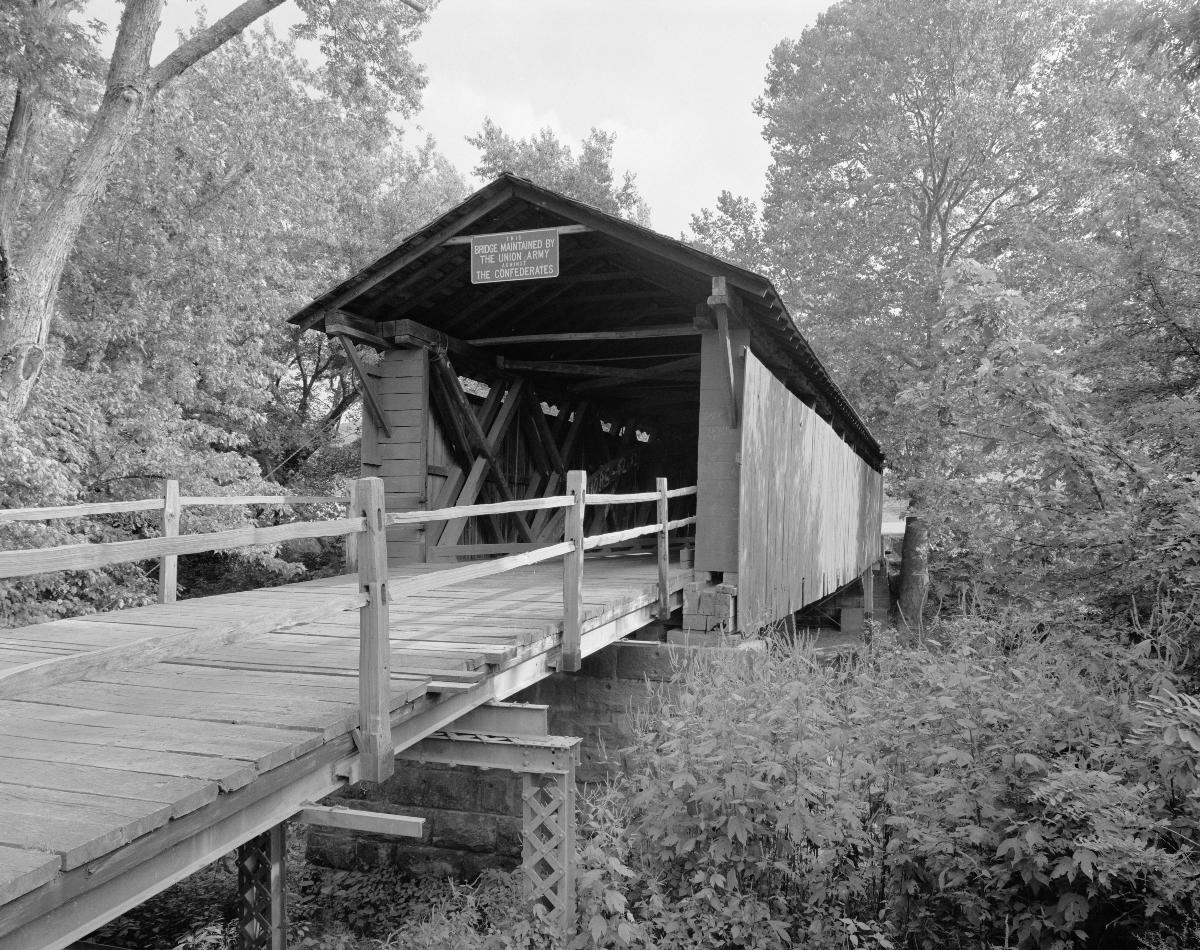 Northern side of the Mud River Covered Bridge, spanning the Mud River near Milton in Cabell County, West Virginia Built in 1875, the bridge was added to the National Register of Historic Places on 10 June 1975.